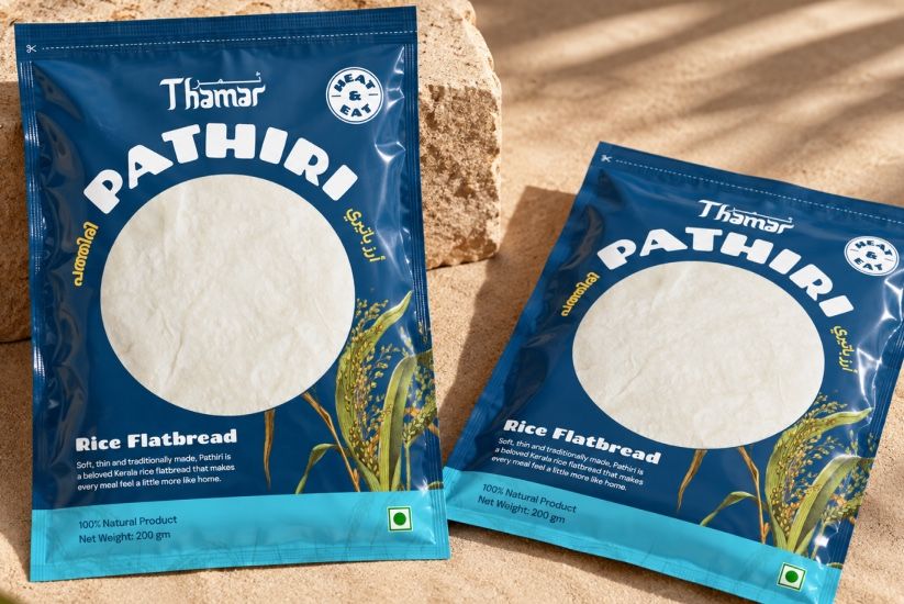 Two blue Thamar Pathiri packs on sandstone in dappled afternoon light.